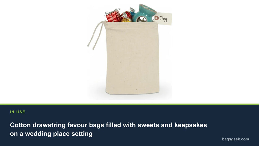 Cotton drawstring favour bags filled with sweets and keepsakes on a wedding place setting